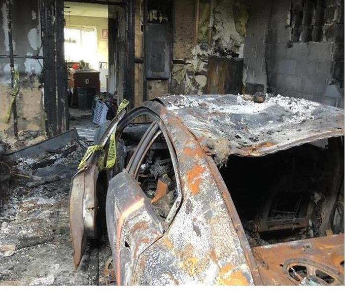 Car burned in garage